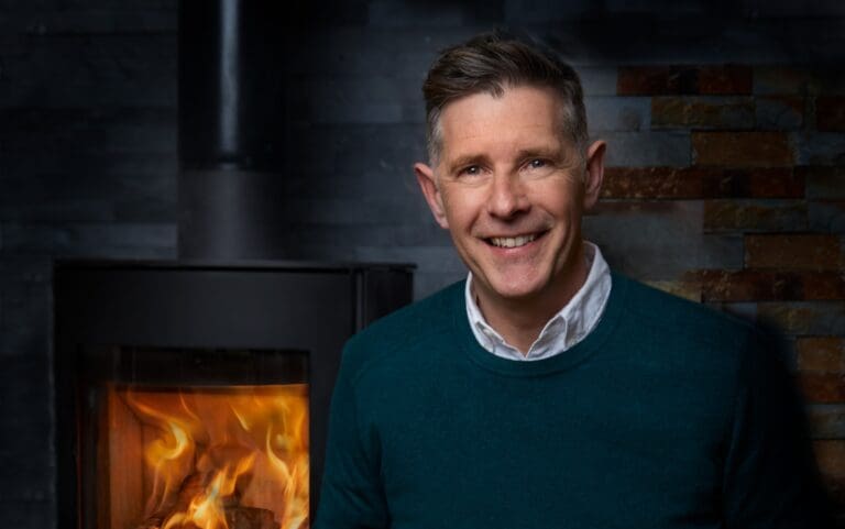 Photo of Dermot Bannon with a stove behind him